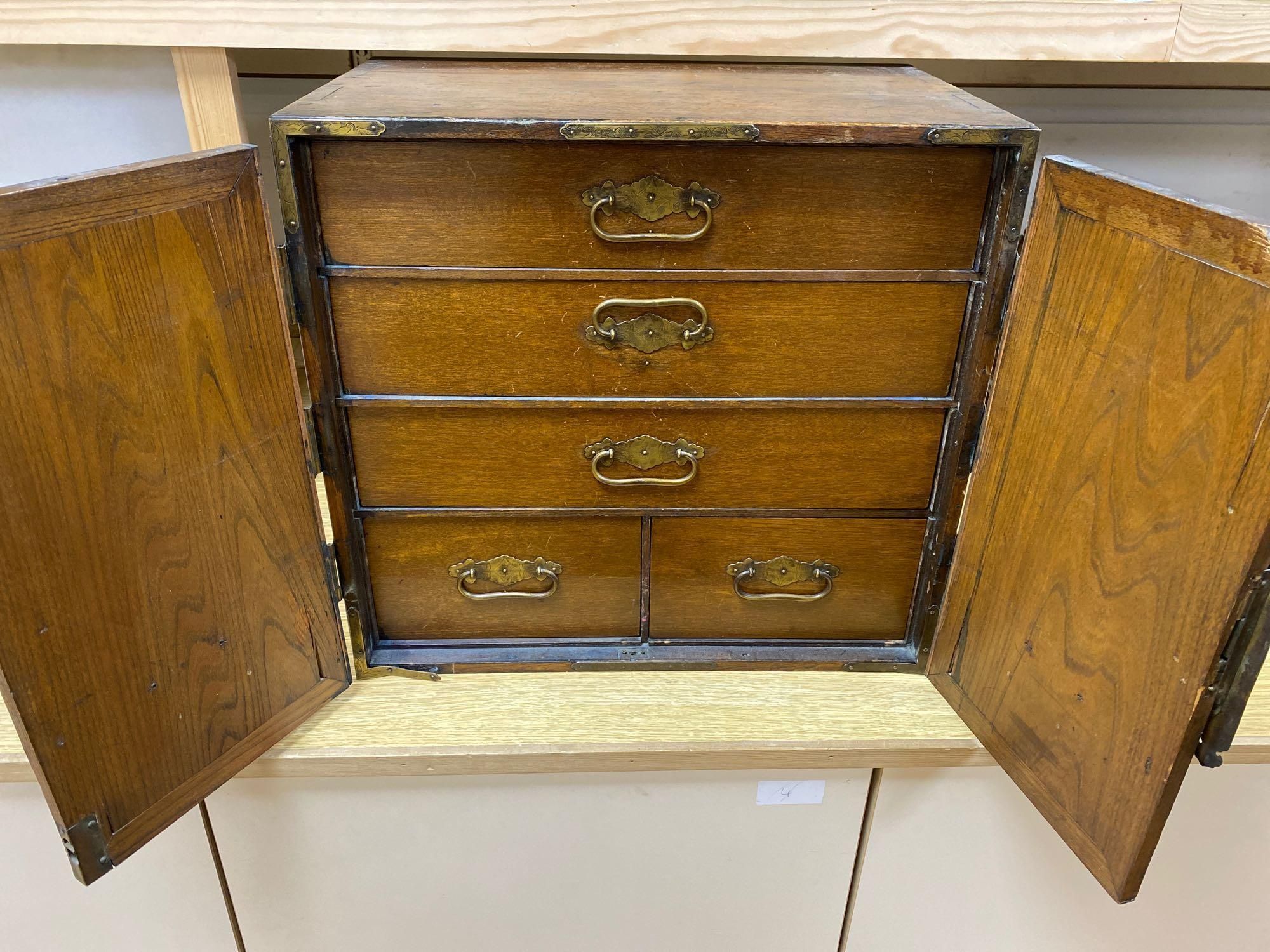 A Korean elm brass mounted table top cabinet